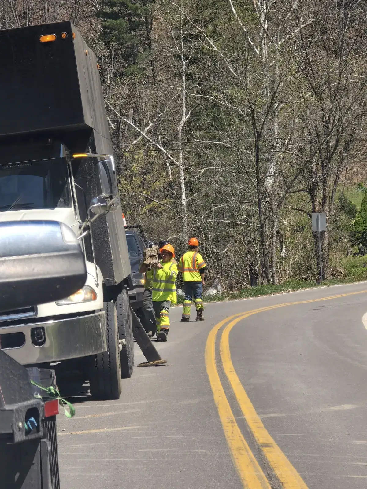 Utility bucket truck working roadside